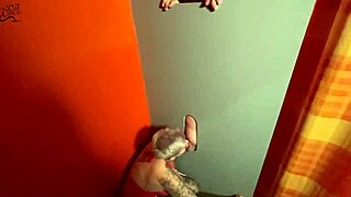 Watch a slut suck off a massive cock at the gloryhole