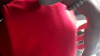 Ebony beauty gives a messy blowjob in a car