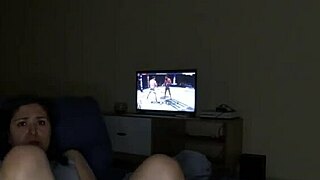 Aroused Latina watches UFC and pleasures herself
