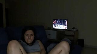 Aroused Latina watches UFC and pleasures herself