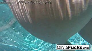 Olivia, a sexy milf, indulges in sensual underwater play
