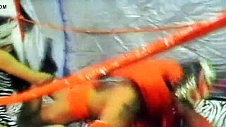 Intense wrestling match between masked monster Dragonfly and seductive Adriana Milano