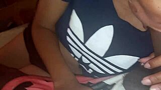 A Latina woman performs oral sex for payment
