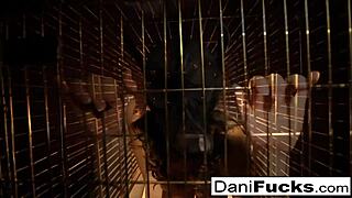 Dani Daniels' seductive performance in a caged bitch scenario