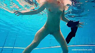 Seductive Avenna reveals her petite beauty in underwater bikini photoshoot