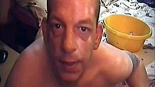 A crossdressing sissy gets humiliated by drinking his own urine