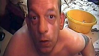 A crossdressing sissy gets humiliated by drinking his own urine