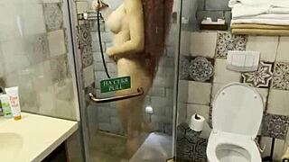 Steaming hot redhead reveals her smooth secrets in the shower