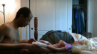 Interracial couple enjoys making out with their black love doll