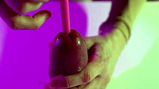 Sensual BDSM encounter featuring penis bondage and urethral play with vibrator