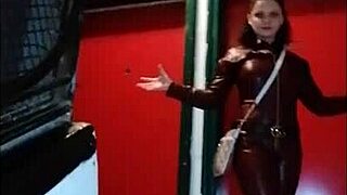 Leather clad femdom in pantyhose and miniskirt