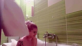 Steamy bath session with natural blonde babe giving a satisfying handjob