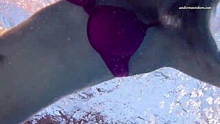 Beautiful Russian girl Elena Prokova swims and poses in the water.