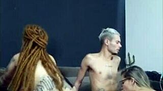 An amateur redhead with dreadlocks has a 4 woman sexual experience with her friend’s wife while he watches.