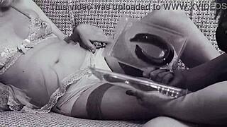 Amateur lesbian video with pregnant MILF and her girlfriend in black and white.
