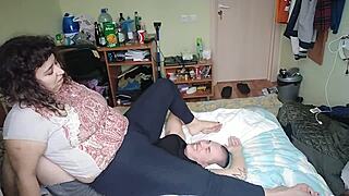 Barefoot and belly down, a femdom's humiliation and worship