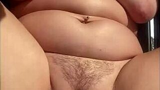 Close up of a wet and hairy vagina during masturbation