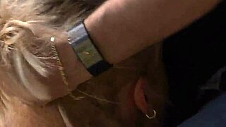 A blonde gets flogged, gagged and fucked on a couch