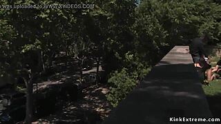 Outdoor BDSM action with handcuffed blonde