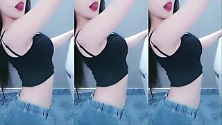 Pretty Chinese girl performs hot dance with vibrator on cam