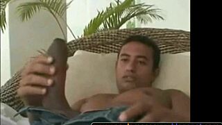 A well-endowed man flaunts his large penis