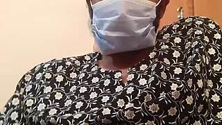 A gay man pleasuring himself in his wife’s silk dress