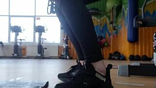 A young woman dancing sexily in the gym