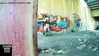 Lovebirds have sex in front of a wall in the street