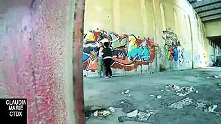Lovebirds have sex in front of a wall in the street