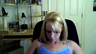 Teenage blonde girl shows off her small boobs on camera