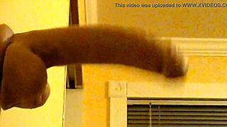 Gay man in hoodie enjoys deep throat penetration with a dildo