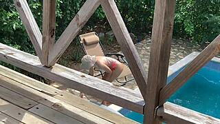 My wife lounges by the pool while I cheat