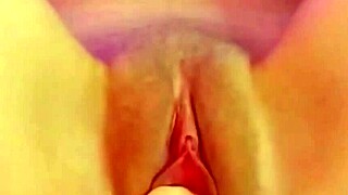 A MILF in lingerie has her puffy pussy pounded and fist fucked