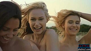 Four girlfriends enjoy lesbian sex on the beach