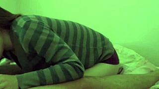 A brunette couple enjoys smoking and oral sex in bed