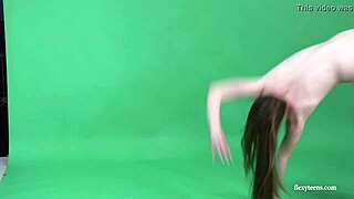 Young brunette gymnast Anna Mostik showing her flexibility