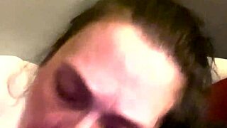 A mature woman gives a deepthroat blow job to a black man