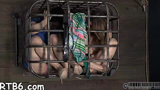 Beautiful girl tied up and stripped in a small iron cage