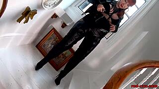 A sexy MILF in red wears leather boots and arouses her body