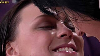 Hot and steamy video of two women engaging in piss play, kissing, and oral sex
