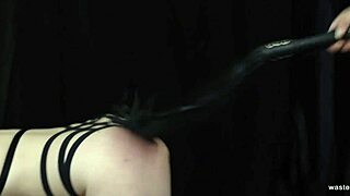 Stephie Starr in BDSM sex scene where she is tied up and giving a blowjob