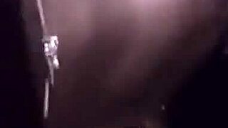 A girl is having fun with someone in a hotel room, making a home video