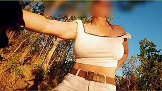 A hot mom is flashing her tits while riding a bike in public
