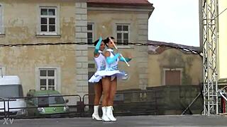 Two charming majorettes in a beautiful uniform are shining with beauty