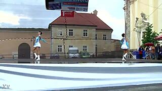 Two charming majorettes in a beautiful uniform are shining with beauty