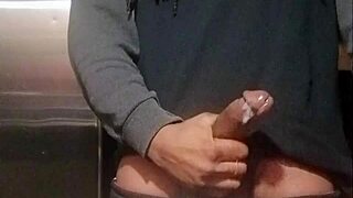 The guy released a nut in the kitchen and watched as it was licked by a housewife