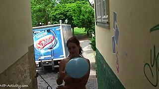 A sexy girl is walking naked on the city streets