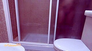 Voyeuristic video captures a girl's solo play with a dildo in the shower