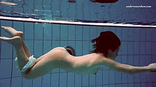 Enjoy watching a Russian babe swim naked in a hot pool