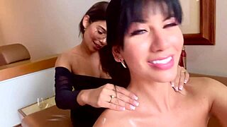 Two Latin women engage in oral pleasure on a hotel sofa